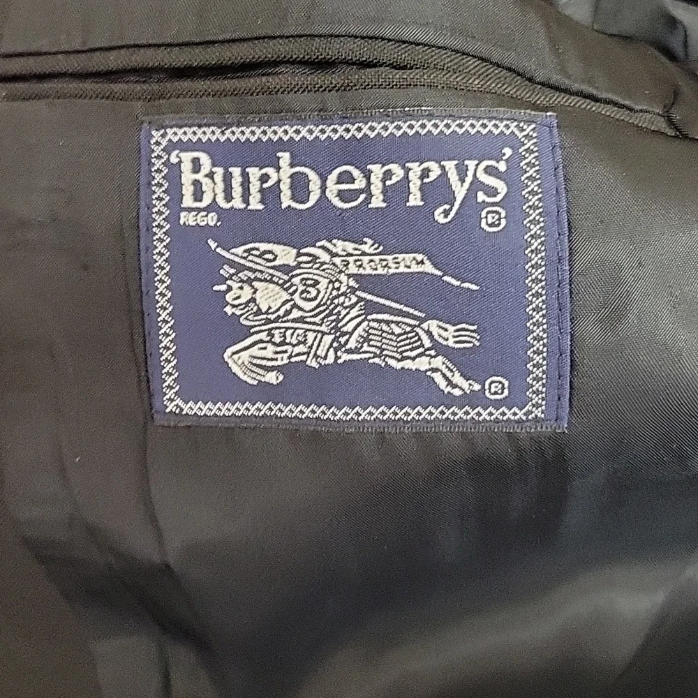 Burberrys vintage 1990s 100% pure wool black suit with tan plaid fabric. 46
